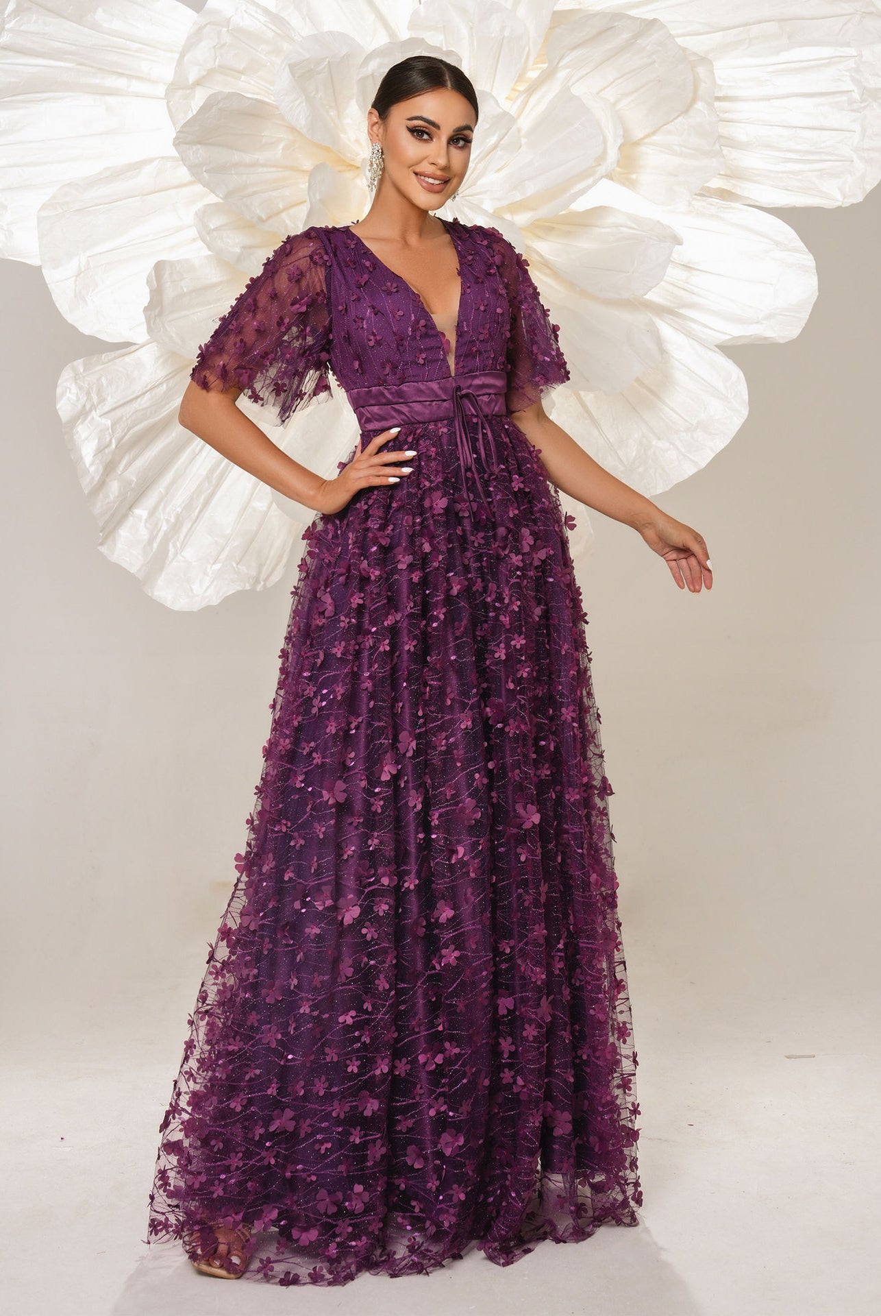 Elegant purple floral gown showcasing high-end fashion and ملابس for special occasions