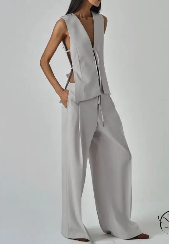 Sleek light gray long sleeve fashion vest with v-neck and wide-leg trousers