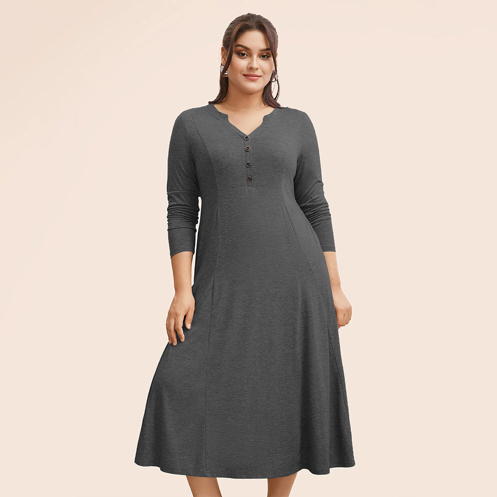 Plus-size woman modeling winter loose long gray midi dress with V-neck and button details