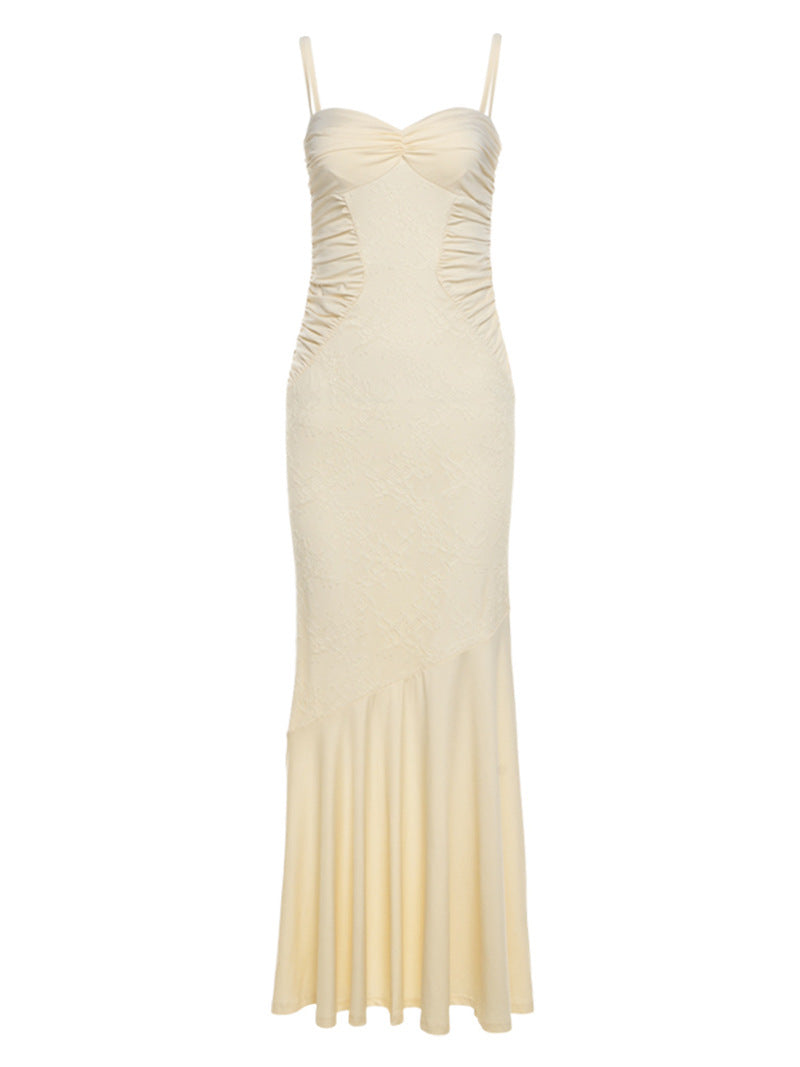 Elegant Cami Dress featuring cream-colored, floor-length design with spaghetti straps