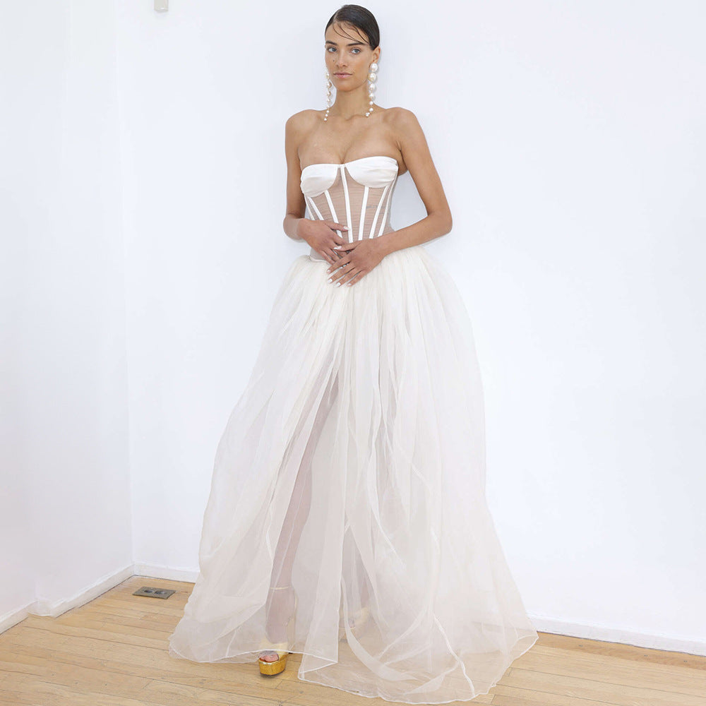 Strapless white wedding gown with corset bodice and flowing tulle skirt for elegant fashion