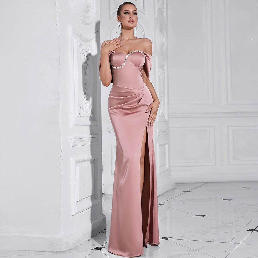Elegant off-shoulder pink evening gown featuring a thigh-high slit and ruched detailing