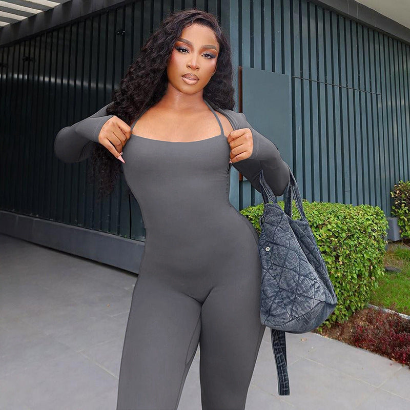 Elegant woman in gray jumpsuit showcasing casual fashion and ملابس style