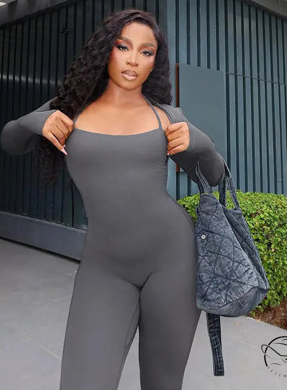 Woman in gray casual tight jumpsuit two piece set