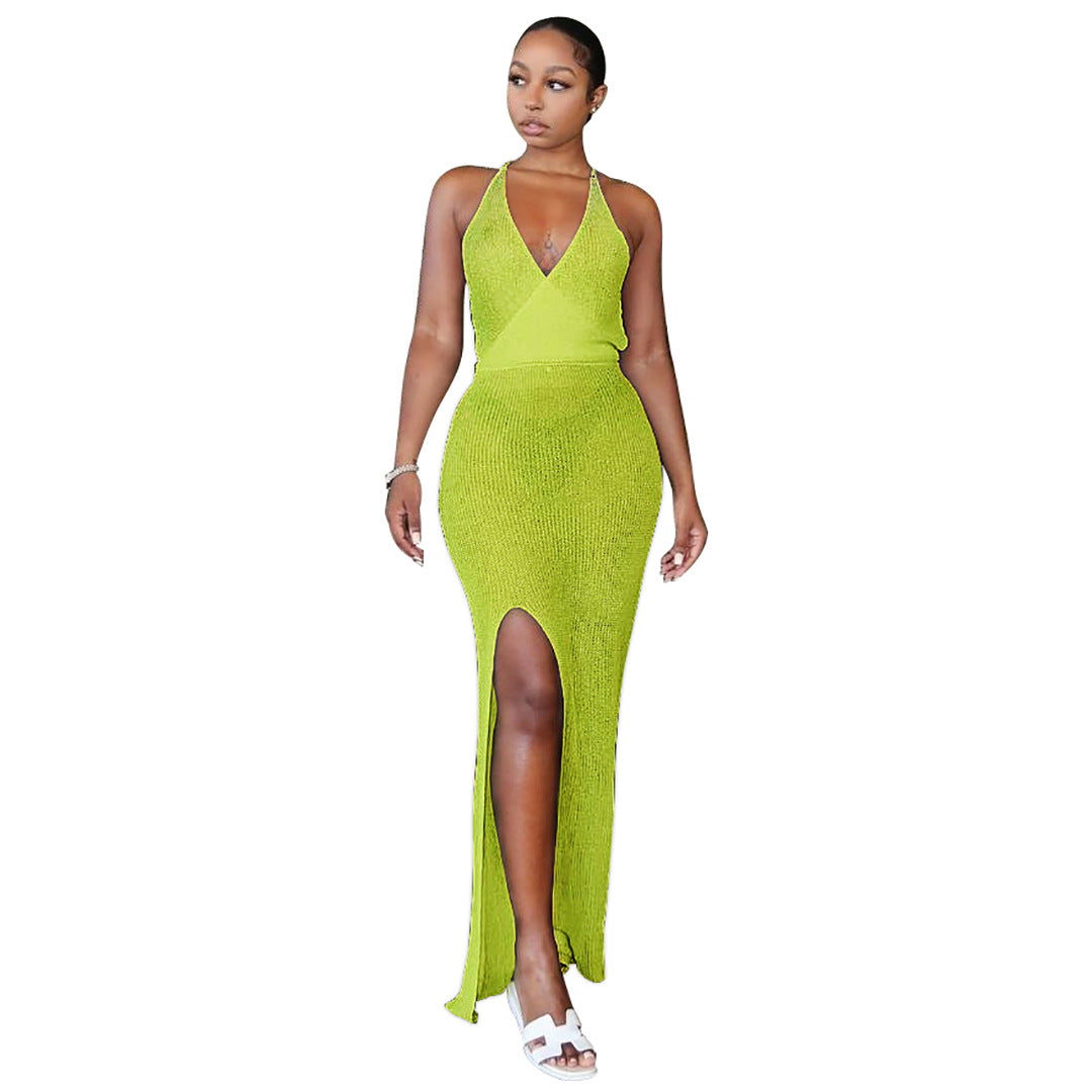 Woman in a green knitted beach maxi dress with a slit, perfect as a light camel beach maxi dress