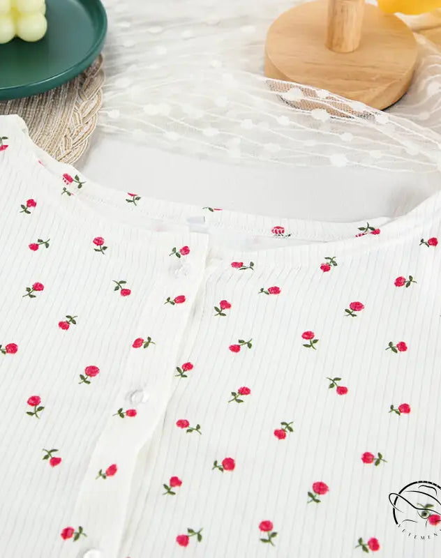 White ribbed knit langry top with red rose print and button closure