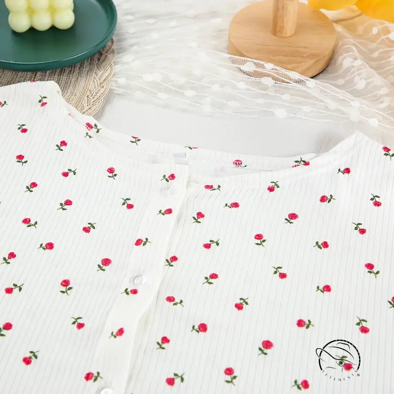 White ribbed knit langry top with red rose print and button closure