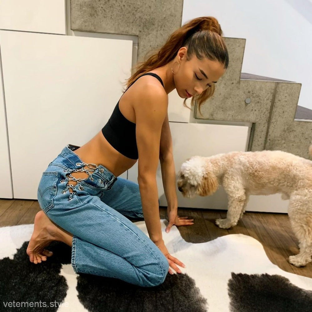 Light-wash blue chain straight jeans with chain-link cutouts at the waist for a sexy straight jeans look