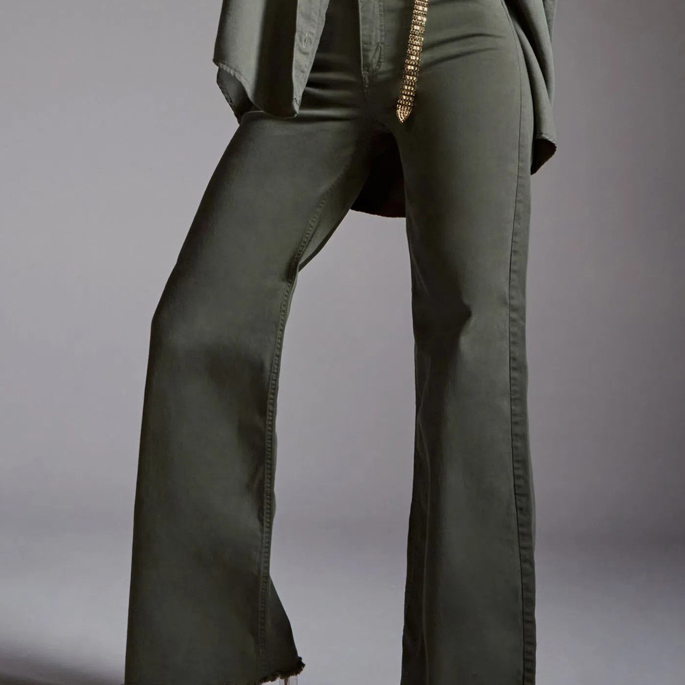 Olive green wide-leg jeans with gold chain belt from Langry fashion ملابس collection