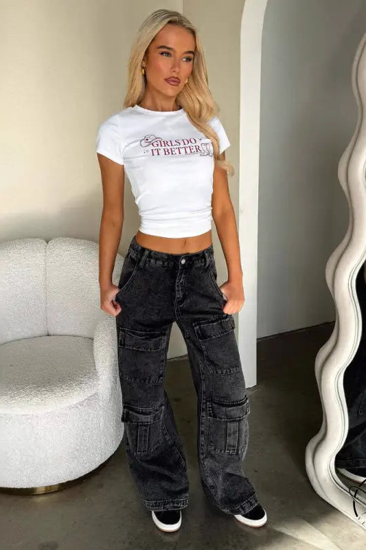 Person in white crop top and vintage pocket washed jeans
