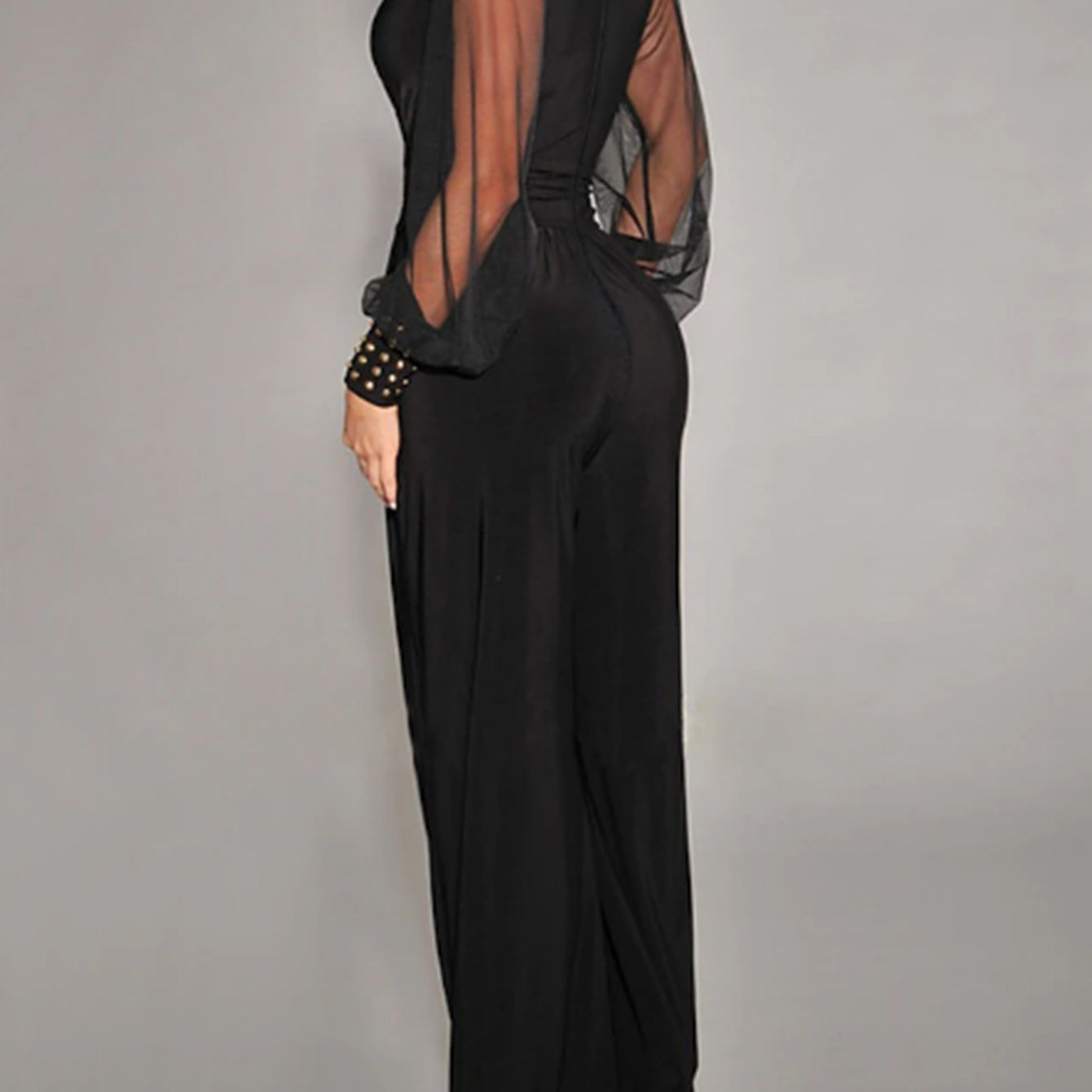 Elegant black jumpsuit with sheer mesh sleeves, perfect for trendy fashion ملابس