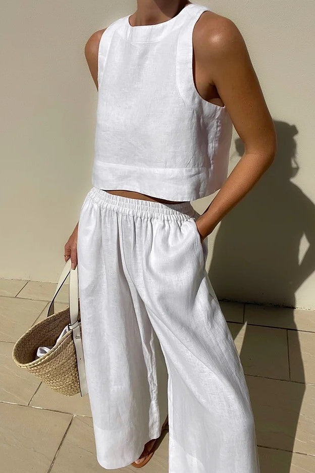 White linen two-piece outfit featuring a casual loose sleeveless shirt for stylish fashion