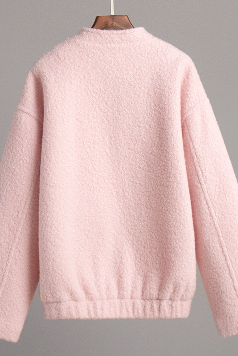 Pink short furry coat displayed in a stylish pink short furry jacket image