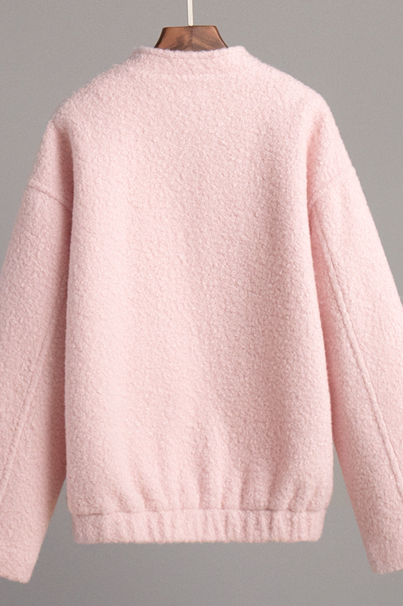 Pink short furry coat displayed in a stylish pink short furry jacket image