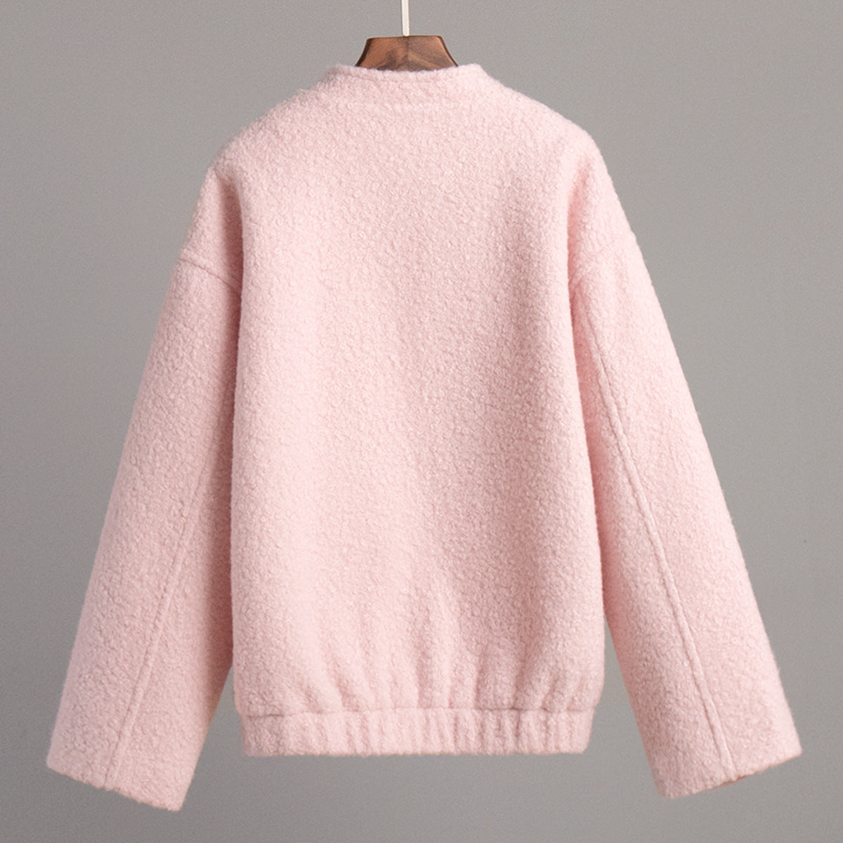 Pink short furry coat displayed in a stylish pink short furry jacket image