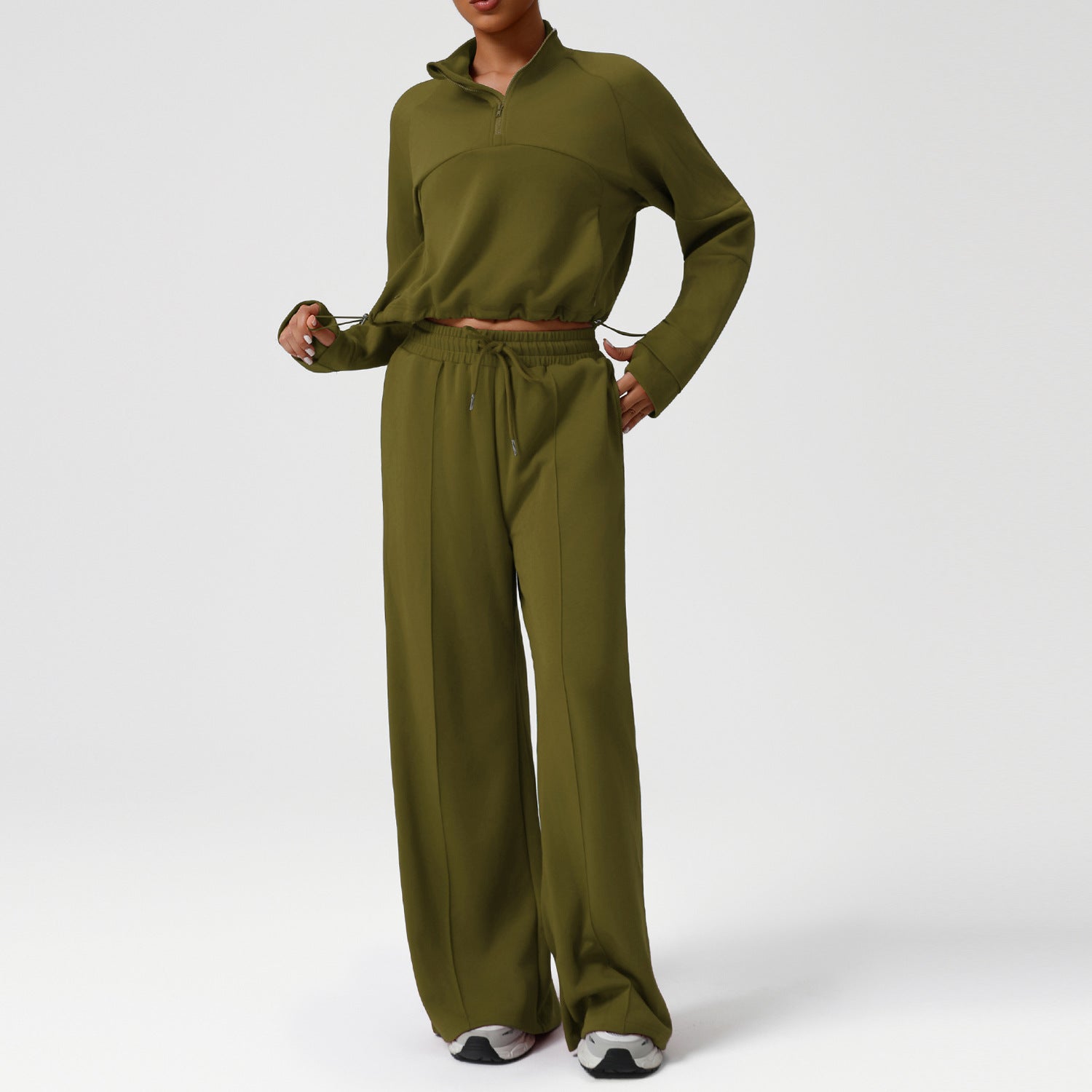 Langry olive green jumpsuit with long sleeves, pockets, stretchy fabric