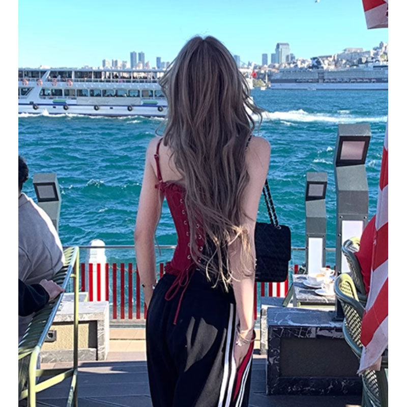 Three-dimensional handmade lace boning corset with red lace-up top and striped skirt