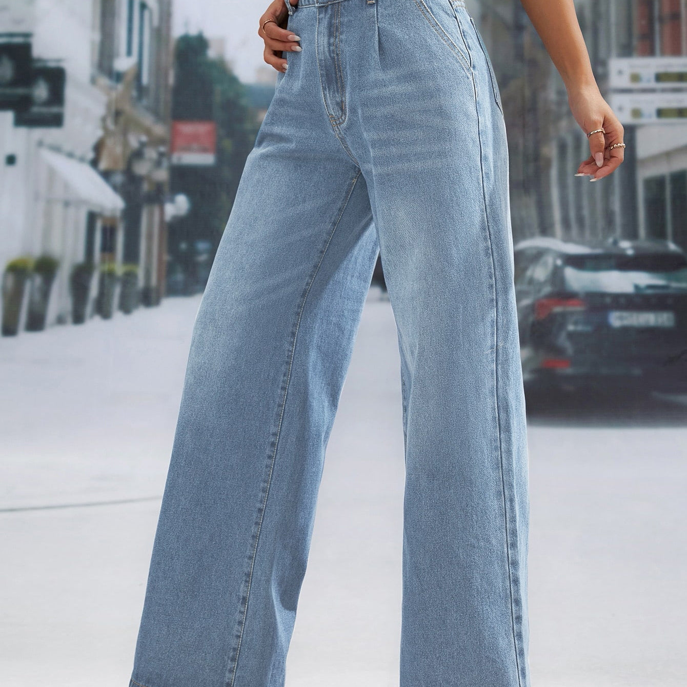 Light wash denim trousers with high waist and wide leg design for a fashionable look