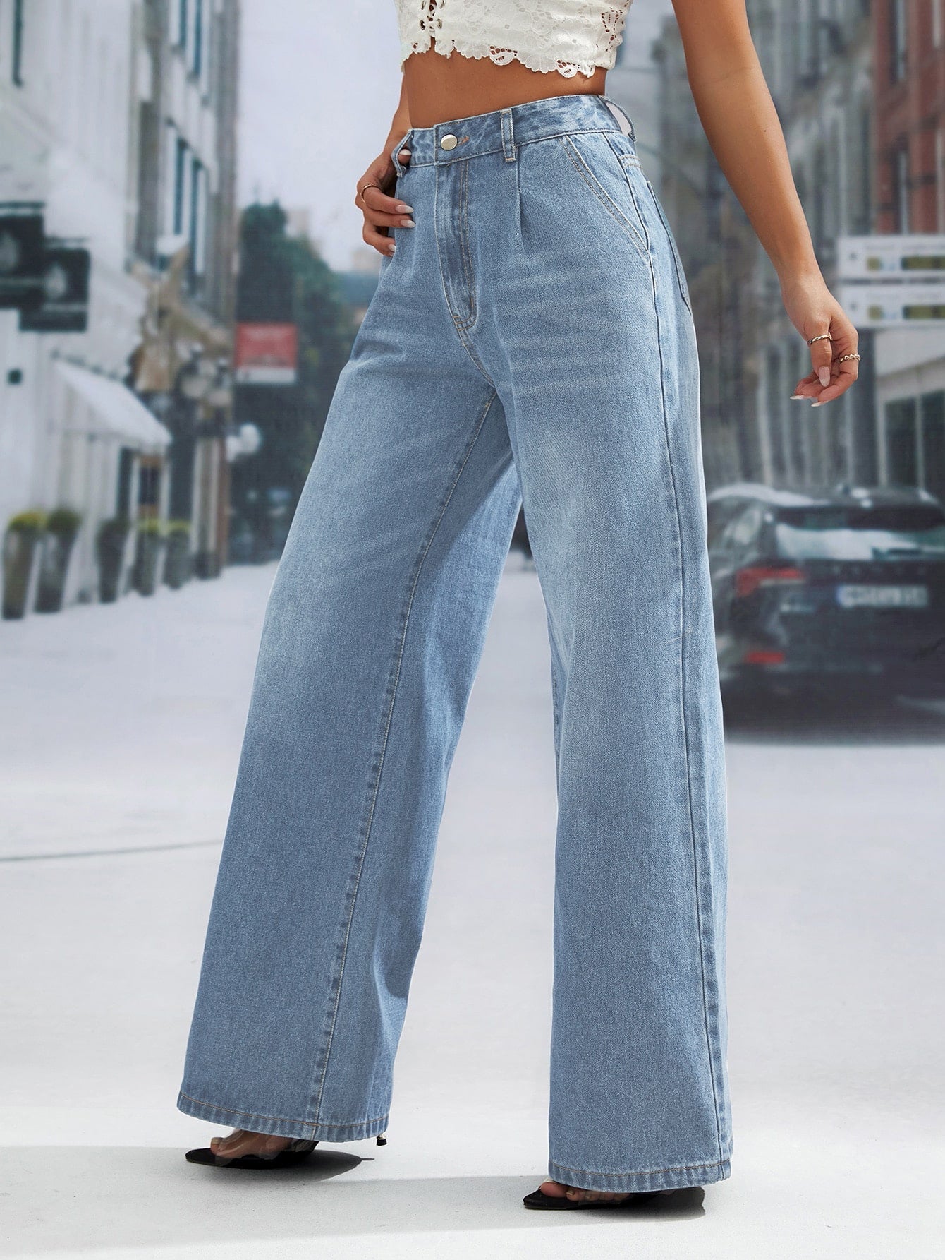 Light wash denim trousers with high waist and wide leg design for a fashionable look