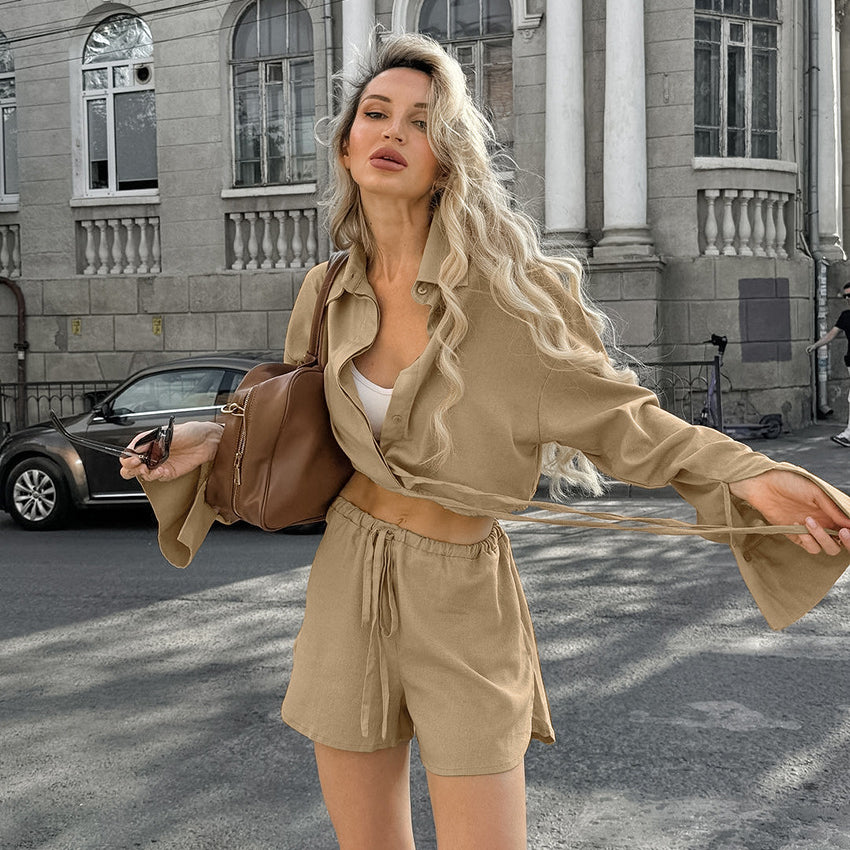 Woman wearing casual cotton linen pajamas set with beige crop top and drawstring shorts