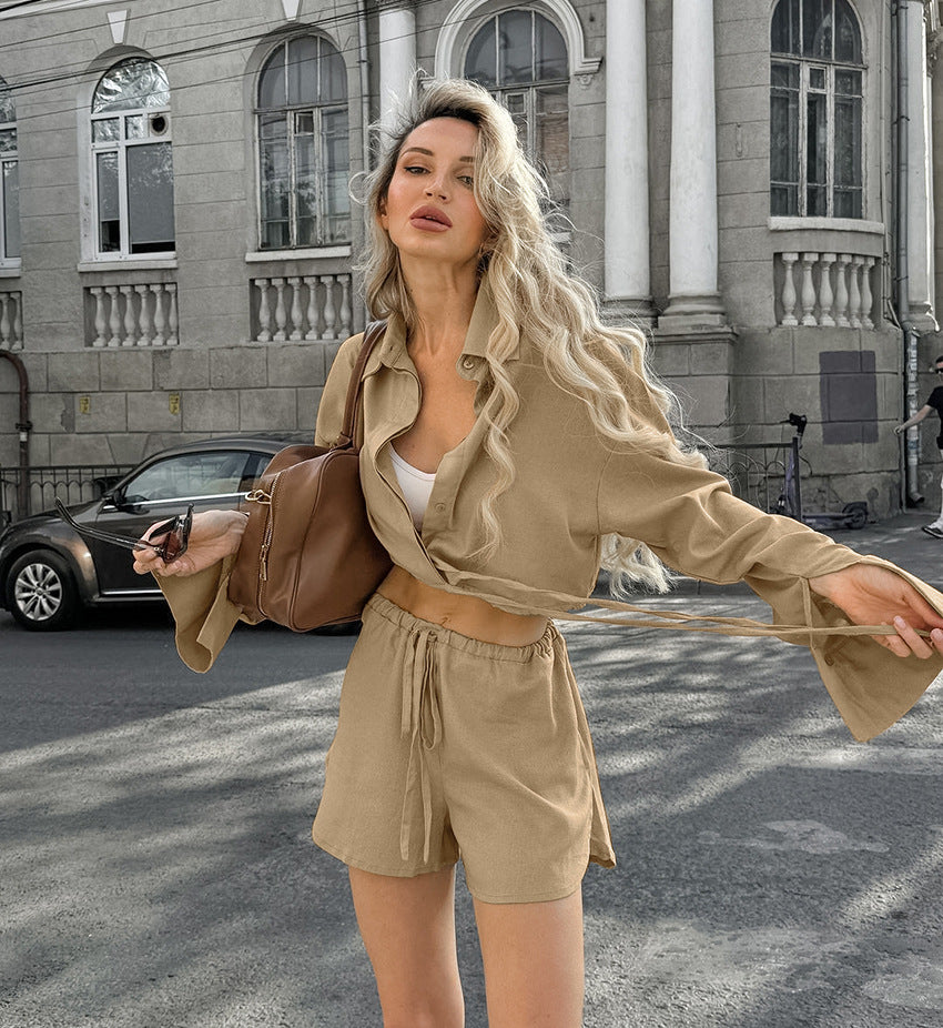Woman wearing casual cotton linen pajamas set with beige crop top and drawstring shorts