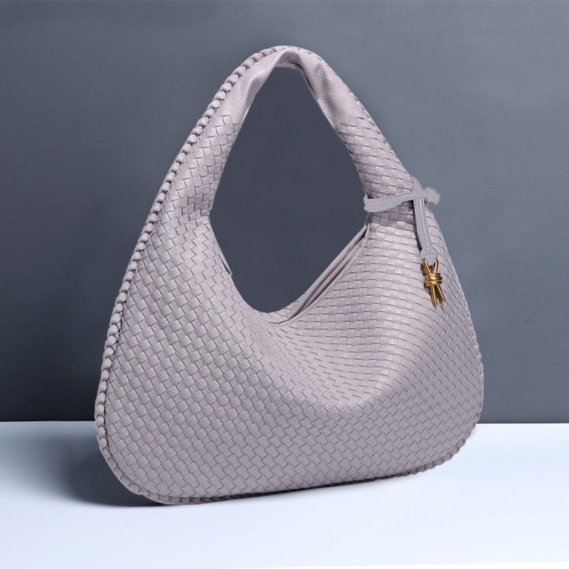 Woven leather hobo bag with gold charm for stylish fashion and ملابس versatility