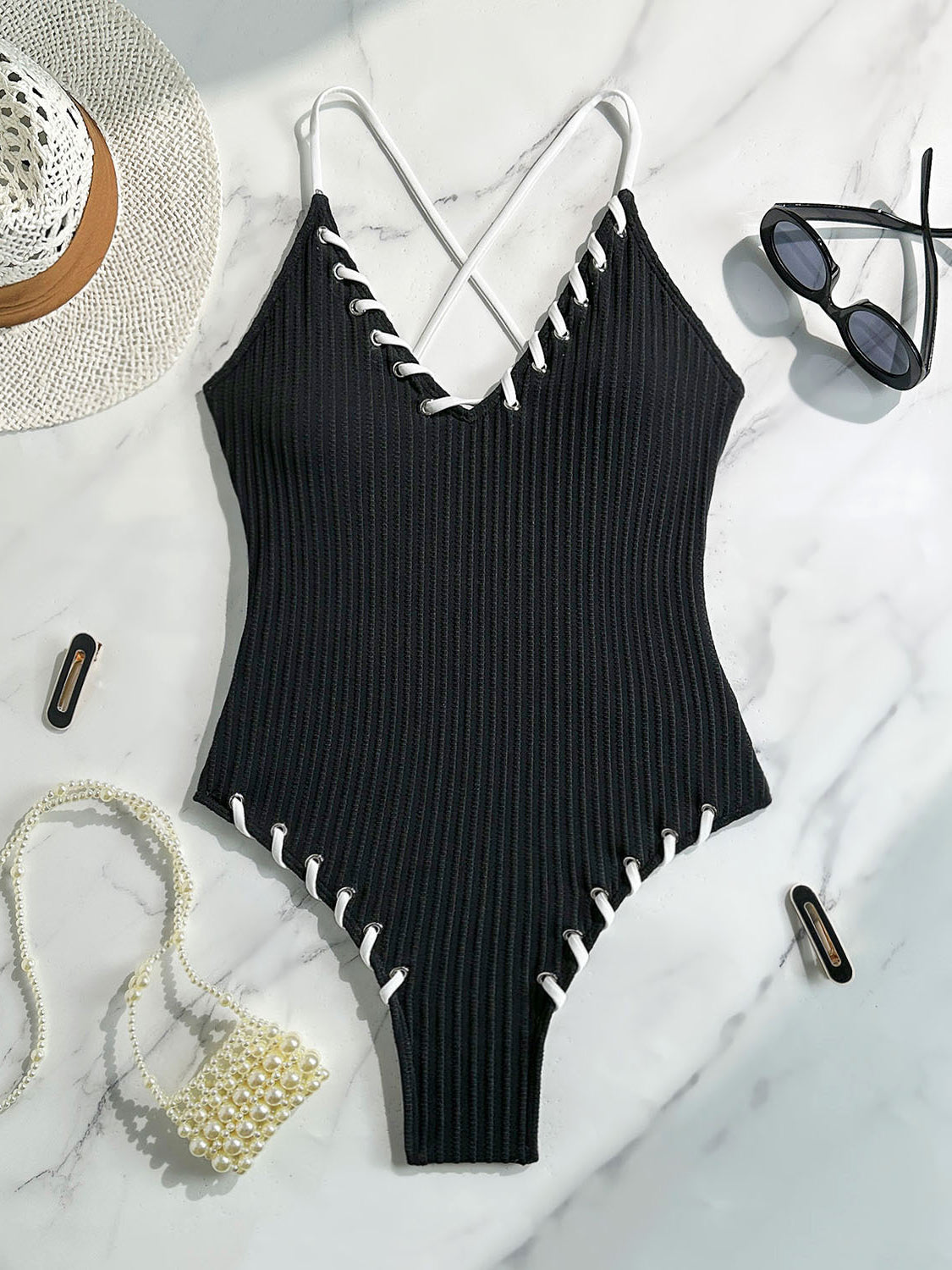 Black ribbed one-piece swimsuit with white stitching for stylish summer fashion ملابس