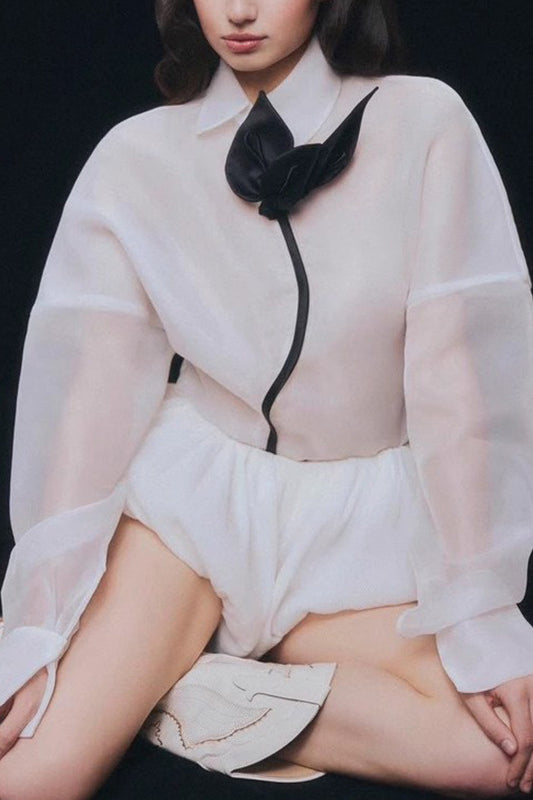 White sheer langry blouse with black accents and bow tie