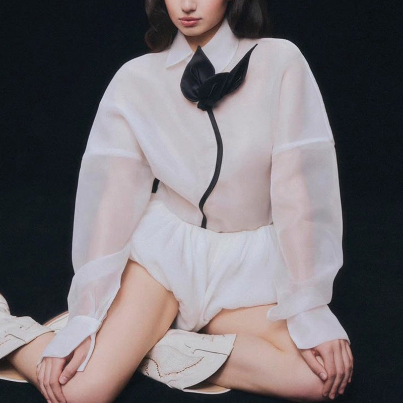 White sheer langry blouse with black accents and bow tie