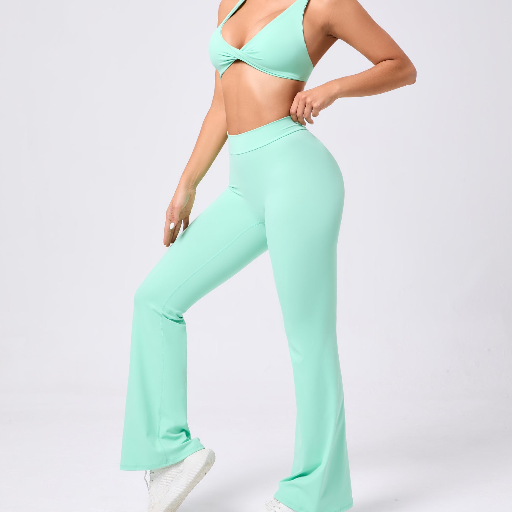 Peach tight brushed yoga pants with mint green flare and bow detail
