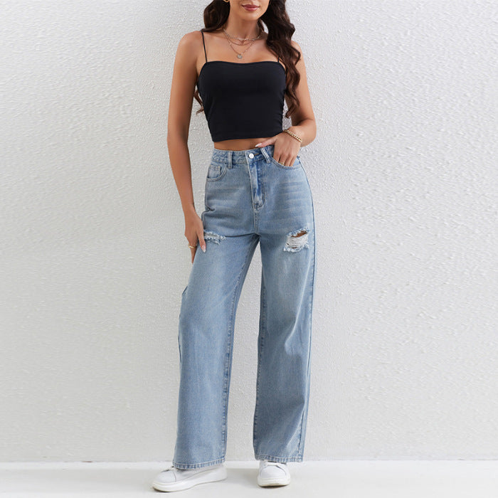 Light blue distressed wide-leg jeans with a black crop top for trendy fashion ملابس