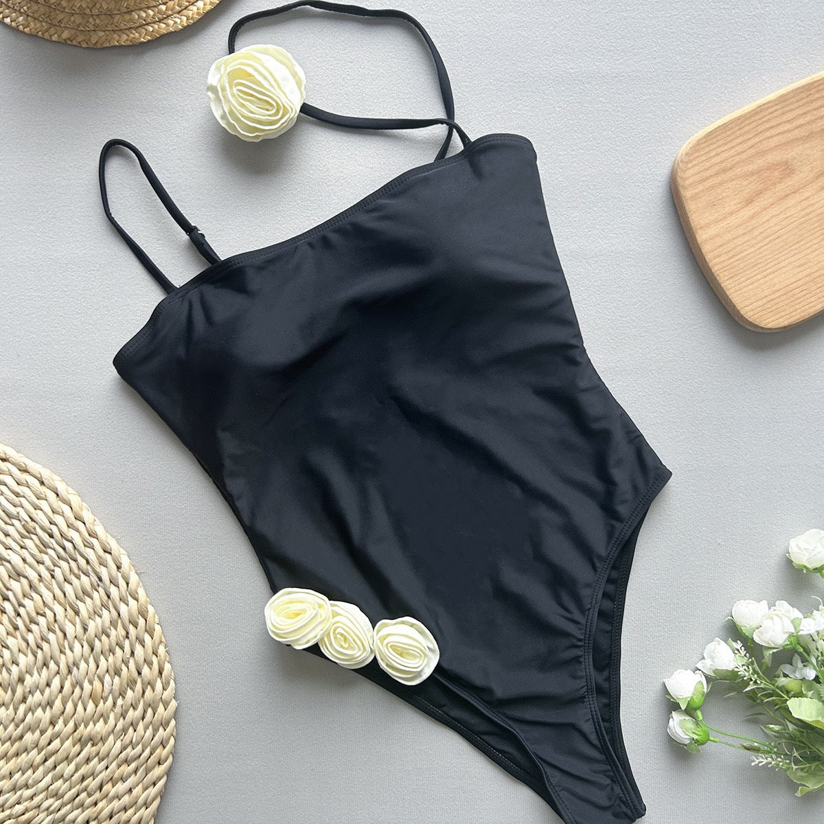 Black one-piece swimsuit with thin shoulder straps from Enchanting Beach Swimwear fashion