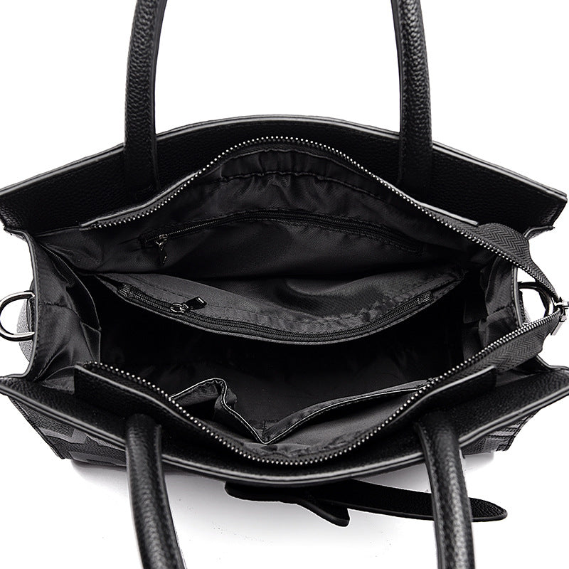 Black leather handbag with compartments and handles, perfect for Langry fashion ملابس