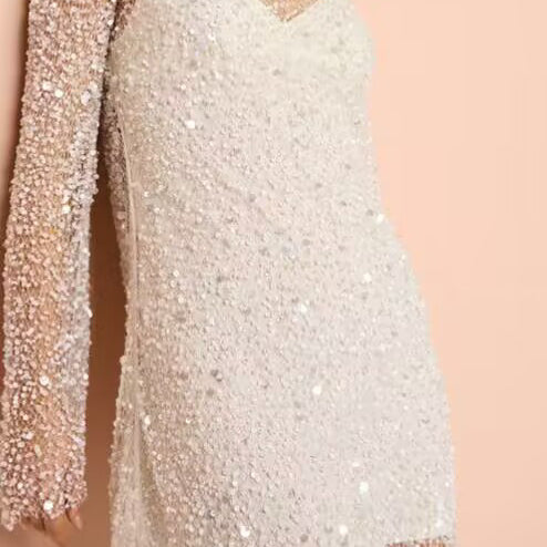 Sparkly white mini dress from Breathtaking Party Dress, perfect for English fashion events and ملابس celebrations