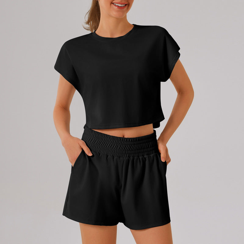 Black crop top and shorts loungewear set with pockets for yoga and fitness fashion