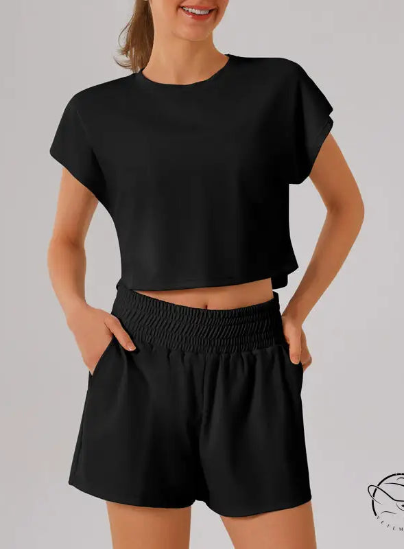 Black loose sports yoga fitness set with crop top, shorts, elastic waistband, pockets