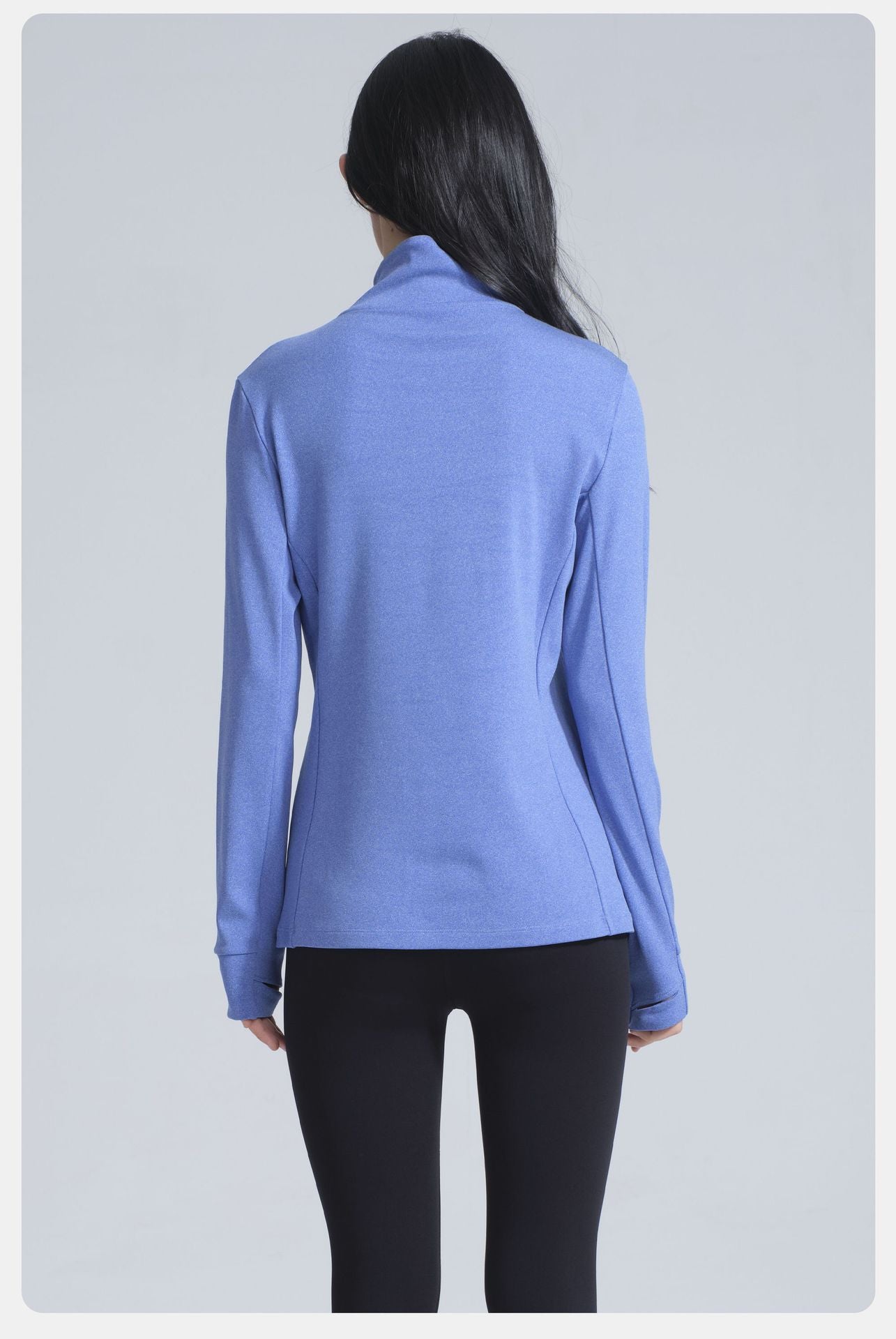 Woman wearing Winter Thermal Velvet Long Sleeved Yoga Jacket in periwinkle for fashionable ملابس