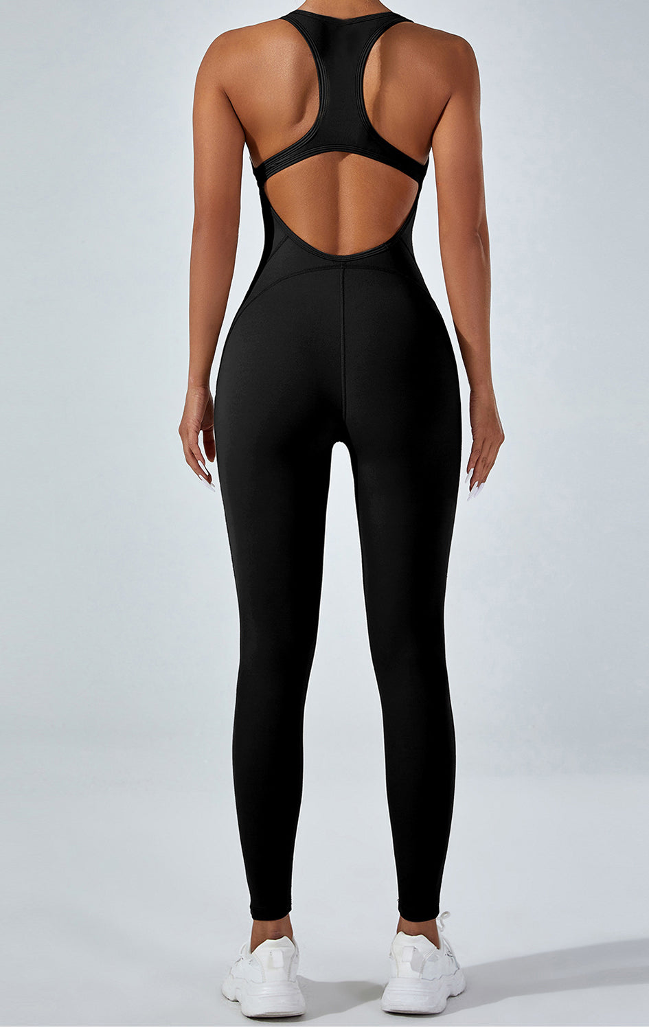 Langry yoga one-piece jumpsuit in black racerback fashion with open back cutout