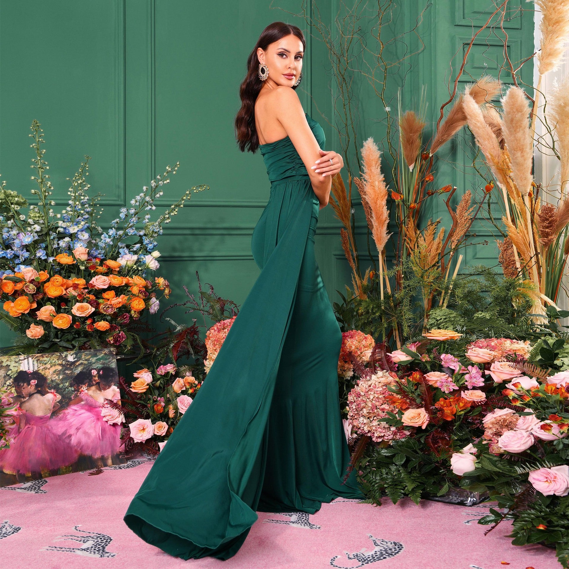 Elegant emerald green strapless evening gown with train, perfect for fashion events