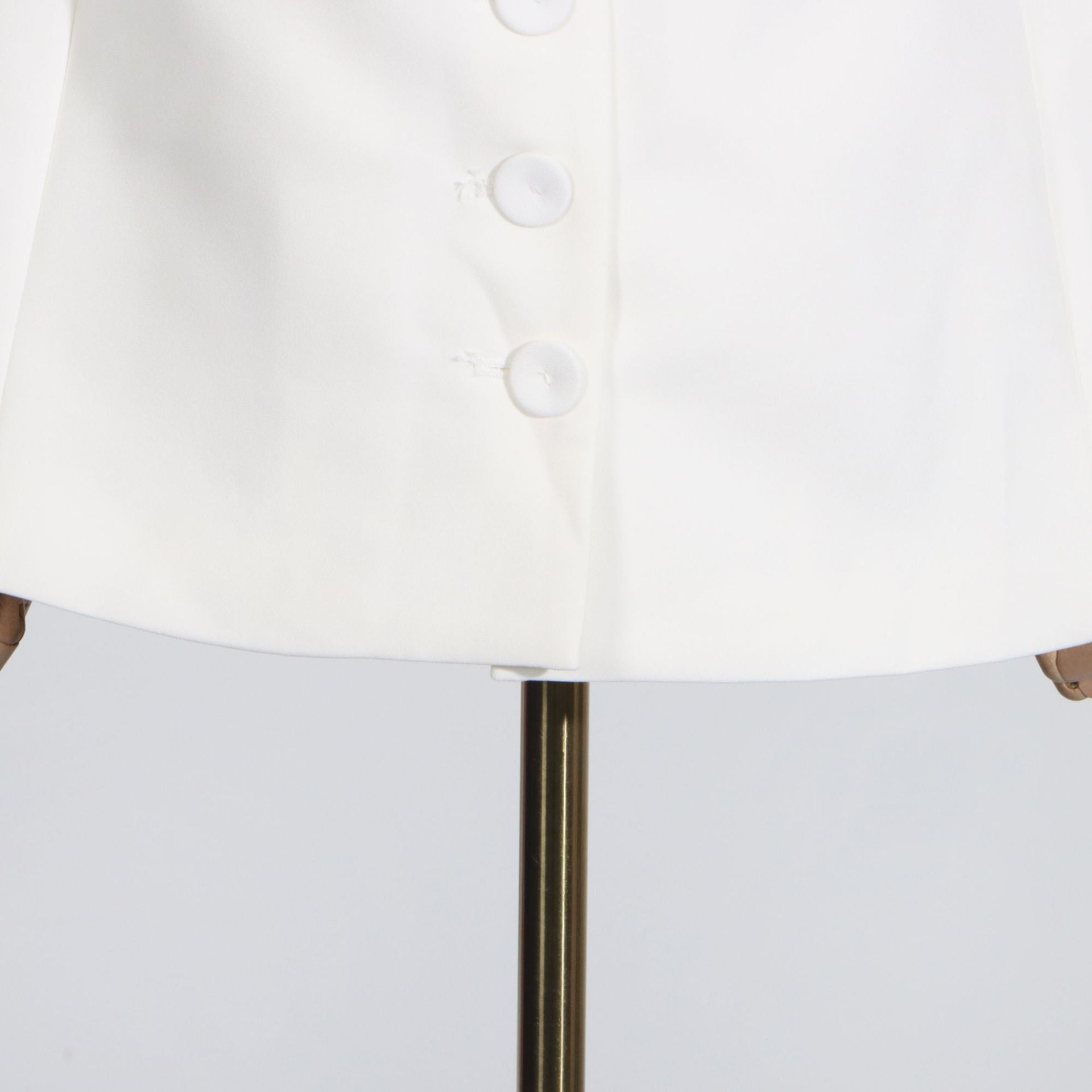 White buttoned jacket complementing Summer Off Shoulder Floral Pocket Stitching Dress in fashion