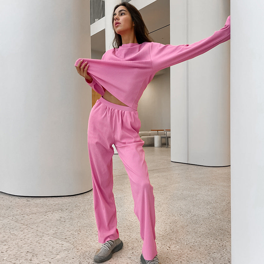 Pink knitted pajamas two piece set featuring a long-sleeved crop top and matching sweatpants