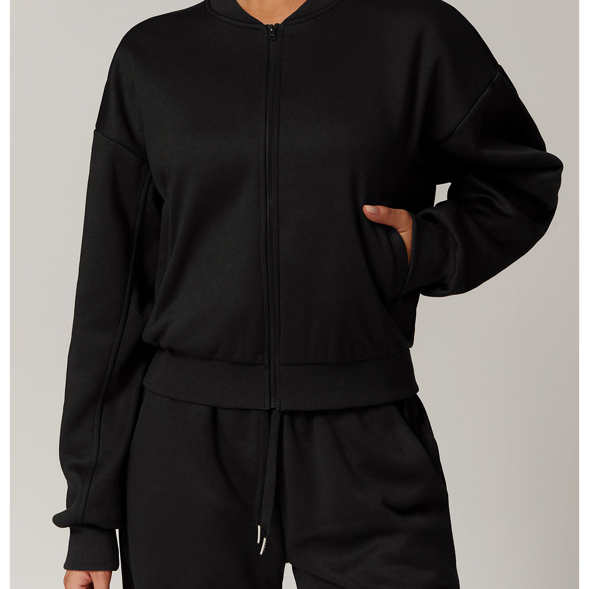 Outdoor warm sports sweater coat featuring black zip-up bomber jacket and sweatpants for fashion and ملابس