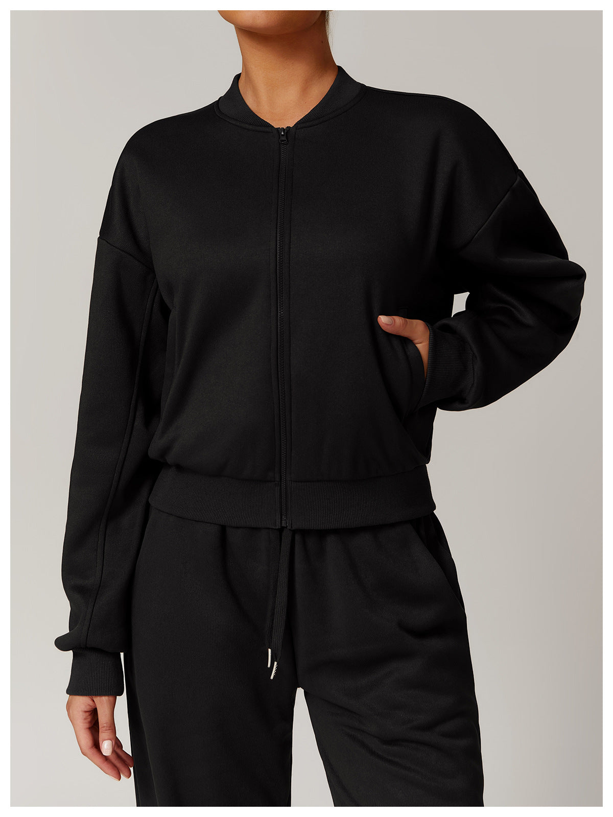 Outdoor warm sports sweater coat featuring black zip-up bomber jacket and sweatpants for fashion and ملابس