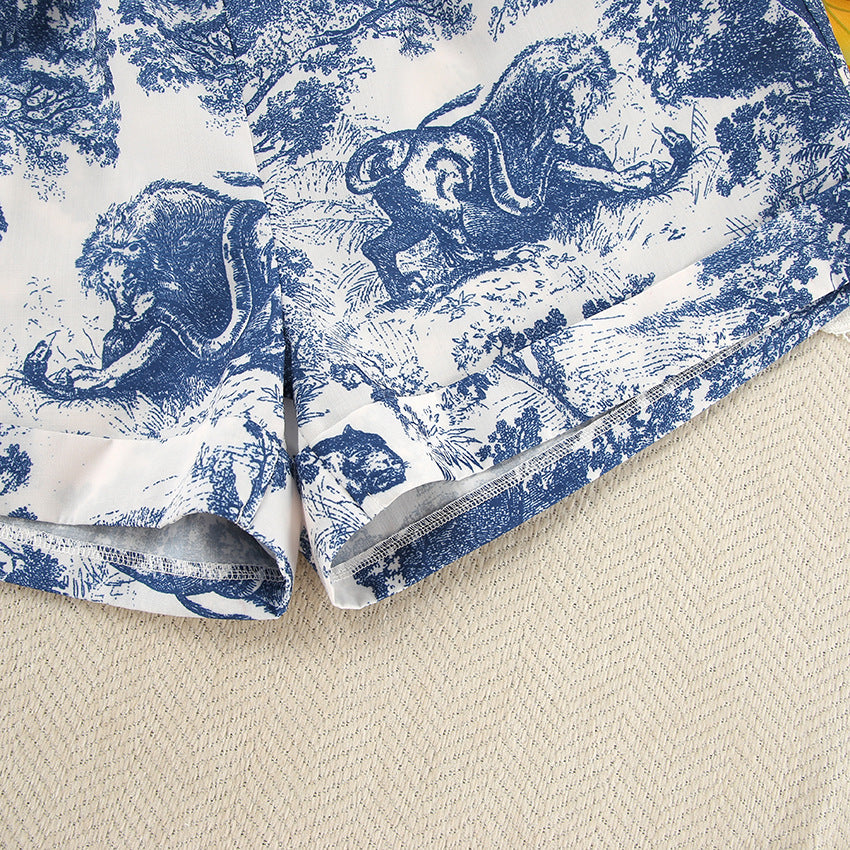 White and blue patterned fabric shorts with rolled hem, ideal for home wear fashion