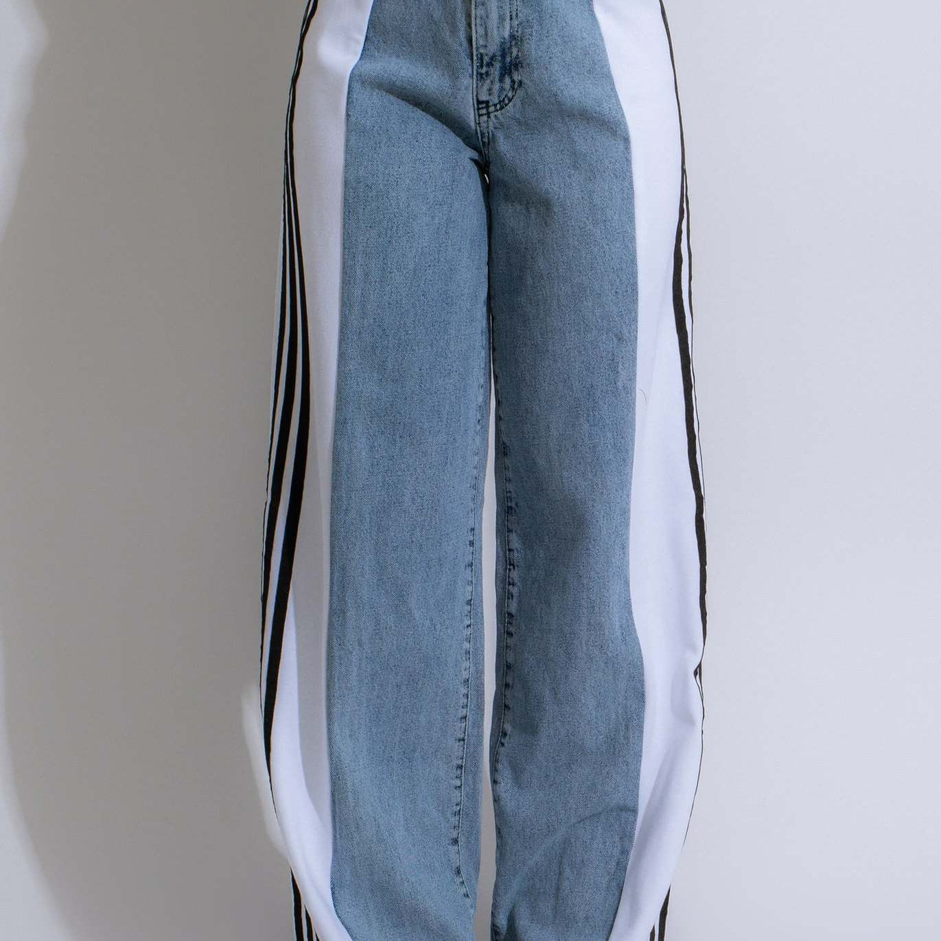 Wide-leg denim jeans with striped side panels, perfect for casual fashion outfits