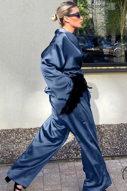 Langry fashion blue satin jumpsuit with black fur belt and high heels ملابس