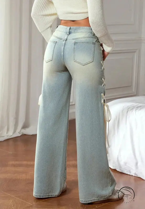 Light-wash wide leg denim pants with lace-up sides in casual fashion