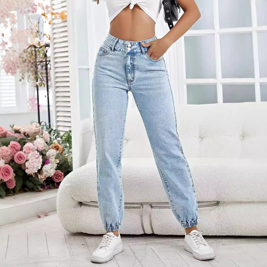 Light wash high-waisted drooping loose denim pants with elasticized cuffs for a relaxed fit