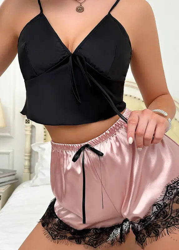 Black satin langry crop top with tie detail and pink shorts with lace trim