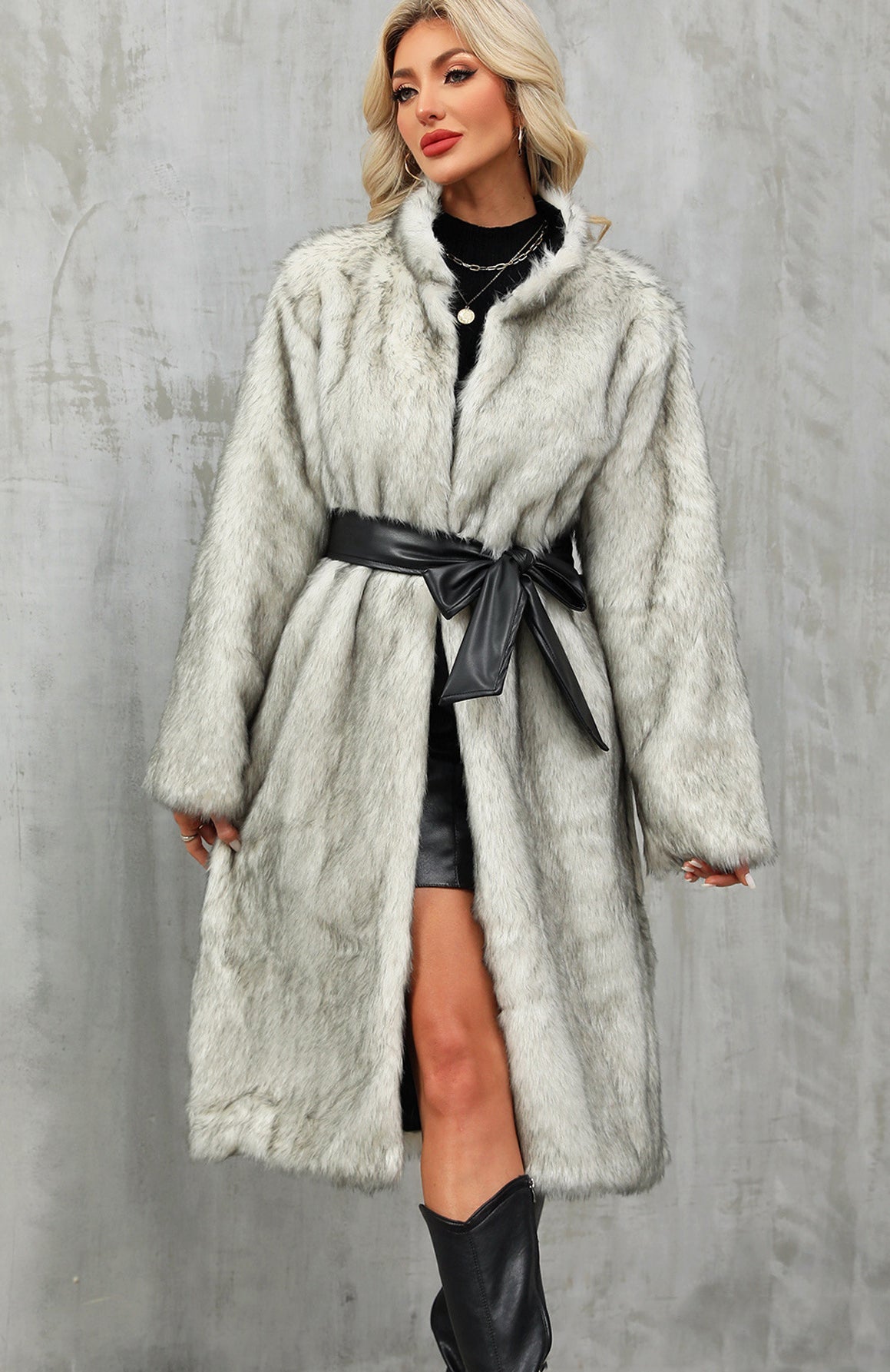 Elegant long faux fur coat with black leather belt and bow